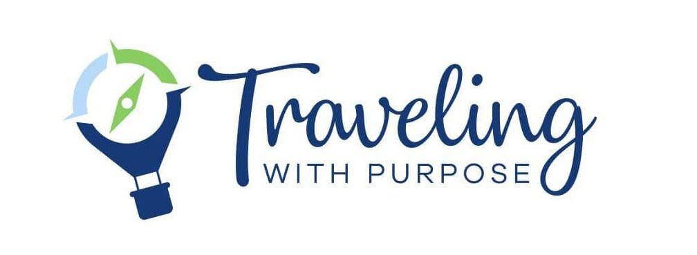 Traveling with purpose logo with icon - Icon is hot air balloon with compass needle in the center.